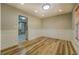 Cozy bedroom with hardwood floors, neutral walls, and a bright window at 2436 Green Hollow Ct, Conyers, GA 30012