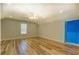 Bedroom featuring wood flooring, neutral walls, and a window providing natural light at 2436 Green Hollow Ct, Conyers, GA 30012