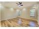 Bedroom with hardwood floors, a ceiling fan and multiple windows at 2436 Green Hollow Ct, Conyers, GA 30012