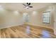 This bedroom features hardwood floors, recessed lighting, and a ceiling fan, offering a modern aesthetic at 2436 Green Hollow Ct, Conyers, GA 30012