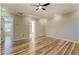 Light-filled bedroom featuring hardwood floors and a ceiling fan at 2436 Green Hollow Ct, Conyers, GA 30012