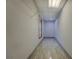 A long walk-in closet featuring decorative tile flooring and ample storage at 2436 Green Hollow Ct, Conyers, GA 30012