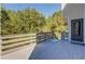 Wood deck featuring gray panels and natural sunlight at 2436 Green Hollow Ct, Conyers, GA 30012