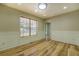 Elegant dining area with wood floors, decorative moldings, and bright natural light at 2436 Green Hollow Ct, Conyers, GA 30012