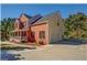 View of the home showcasing its side-entry garage and architectural details at 2436 Green Hollow Ct, Conyers, GA 30012