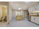 Open kitchen design with tile floors, kitchen island and access to nearby bathroom at 2436 Green Hollow Ct, Conyers, GA 30012