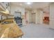 A spacious eat-in kitchen featuring stainless appliances and light granite countertops at 2436 Green Hollow Ct, Conyers, GA 30012