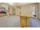 A bright, large kitchen featuring a granite-topped island and light cabinets at 2436 Green Hollow Ct, Conyers, GA 30012