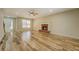 Large living room with fireplace, hardwood floors, and an adjacent entryway at 2436 Green Hollow Ct, Conyers, GA 30012