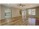 Open-concept living room with hardwood floors, fireplace, and views into the kitchen at 2436 Green Hollow Ct, Conyers, GA 30012