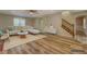 Staged living room featuring hardwood floors and a comfortable seating area at 2436 Green Hollow Ct, Conyers, GA 30012