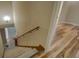 Carpeted staircase leading to wood floors on landing at 2436 Green Hollow Ct, Conyers, GA 30012