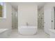 Spa-like primary bathroom featuring a soaking tub and dual glass-enclosed showers at 2517 Canopy Ct, Marietta, GA 30066