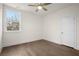 Hardwood floors, crown molding, ceiling fan, and large window in this empty bedroom at 2517 Canopy Ct, Marietta, GA 30066