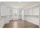 Spacious walk-in closet with custom shelving, drawers, hardwood floors, and a window seat at 2517 Canopy Ct, Marietta, GA 30066