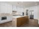 Open kitchen featuring an island, stainless steel appliances, and white cabinets at 2517 Canopy Ct, Marietta, GA 30066