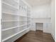 Spacious pantry featuring custom built-in shelving, ample storage, and hardwood flooring at 2517 Canopy Ct, Marietta, GA 30066