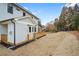 Rear view of the home highlights a spacious yard and a wooden deck for outdoor enjoyment at 2517 Canopy Ct, Marietta, GA 30066