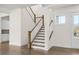 Inviting staircase with hardwood steps and white railings leads to the upper level of this beautiful home at 2517 Canopy Ct, Marietta, GA 30066