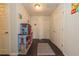 Hallway with dark floors features a dollhouse and multiple doors, enhancing storage at 275 Fern Crest Dr, Lawrenceville, GA 30046