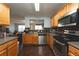 Functional kitchen featuring stainless steel appliances, wooden cabinets, and hardwood floors at 275 Fern Crest Dr, Lawrenceville, GA 30046