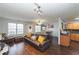 Comfortable living area featuring wood floors, a ceiling fan, and ample natural light at 275 Fern Crest Dr, Lawrenceville, GA 30046