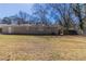 A well-maintained, grassy backyard with a brick home and privacy fencing at 3716 Loren Dr, Decatur, GA 30032