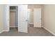 An empty bedroom featuring carpet, neutral wall paint, and white trim at 3716 Loren Dr, Decatur, GA 30032