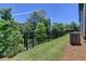 Fenced backyard with lush greenery, offering privacy and a serene outdoor space at 3856 Allegretto Cir, Atlanta, GA 30339