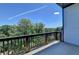 View from a balcony overlooking a wooded area and city skyline at 3856 Allegretto Cir, Atlanta, GA 30339