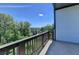 View from a balcony overlooking a wooded area and city skyline at 3856 Allegretto Cir, Atlanta, GA 30339