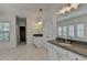 Bathroom showcasing double vanities, large mirror, and soaking tub in a spacious, bright area at 3856 Allegretto Cir, Atlanta, GA 30339