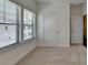 Bright bedroom featuring neutral carpet, and a window with horizontal blinds at 3856 Allegretto Cir, Atlanta, GA 30339