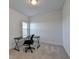 Clean, carpeted office featuring black computer chair and desk at 3856 Allegretto Cir, Atlanta, GA 30339