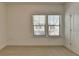 Carpeted bedroom with natural light and white trim at 3856 Allegretto Cir, Atlanta, GA 30339