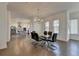 Open-concept dining room with a view into kitchen, seamlessly blending style and function at 3856 Allegretto Cir, Atlanta, GA 30339