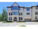 Charming townhome featuring a brick facade, arched entryway and attached garage at 3856 Allegretto Cir, Atlanta, GA 30339