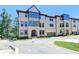 Attractive townhome showcasing well-maintained landscaping and an attached garage at 3856 Allegretto Cir, Atlanta, GA 30339