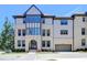 Beautiful townhome featuring a brick facade, arched entryway and attached garage at 3856 Allegretto Cir, Atlanta, GA 30339