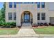 Welcoming front entrance with a beautiful arched doorway and steps leading to the main level at 3856 Allegretto Cir, Atlanta, GA 30339