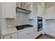 Gourmet kitchen with stainless steel appliances, quartz countertops, and gray backsplash at 3856 Allegretto Cir, Atlanta, GA 30339