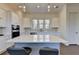 Kitchen featuring a large island, quartz countertop, pendant lighting, and stainless steel appliances at 3856 Allegretto Cir, Atlanta, GA 30339