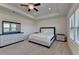 Main bedroom has a tray ceiling, carpet, ceiling fan, and a dresser with mirror at 3856 Allegretto Cir, Atlanta, GA 30339