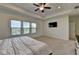 Large main bedroom features a tray ceiling, ceiling fan, recessed lights, and three windows at 3856 Allegretto Cir, Atlanta, GA 30339