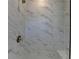 Close up of elegant shower with sleek, neutral, marble-like tiling at 3856 Allegretto Cir, Atlanta, GA 30339