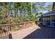 Spacious wooden deck overlooking the yard with an outdoor dining area perfect for relaxation and entertaining at 6507 Bennington Dr, Tucker, GA 30084