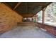 View of open brick patio beneath the home's deck, offering outdoor space at 6507 Bennington Dr, Tucker, GA 30084