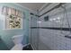 Bathroom with a tiled shower and neutral wall colors, featuring a modern shower head at 6507 Bennington Dr, Tucker, GA 30084