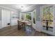 Bright breakfast nook with a bay window, hardwood flooring, and a door leading to the outside at 6507 Bennington Dr, Tucker, GA 30084