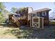 Backyard view showcasing deck, shed, and the home's architectural design at 6507 Bennington Dr, Tucker, GA 30084